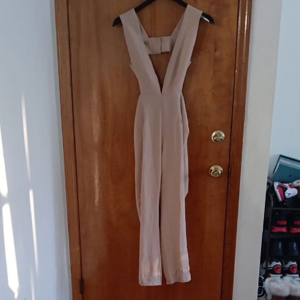 Lioness Chic Tan Jumpsuit with Wide Legs and Sleeveless Design - Picture 1 of 5